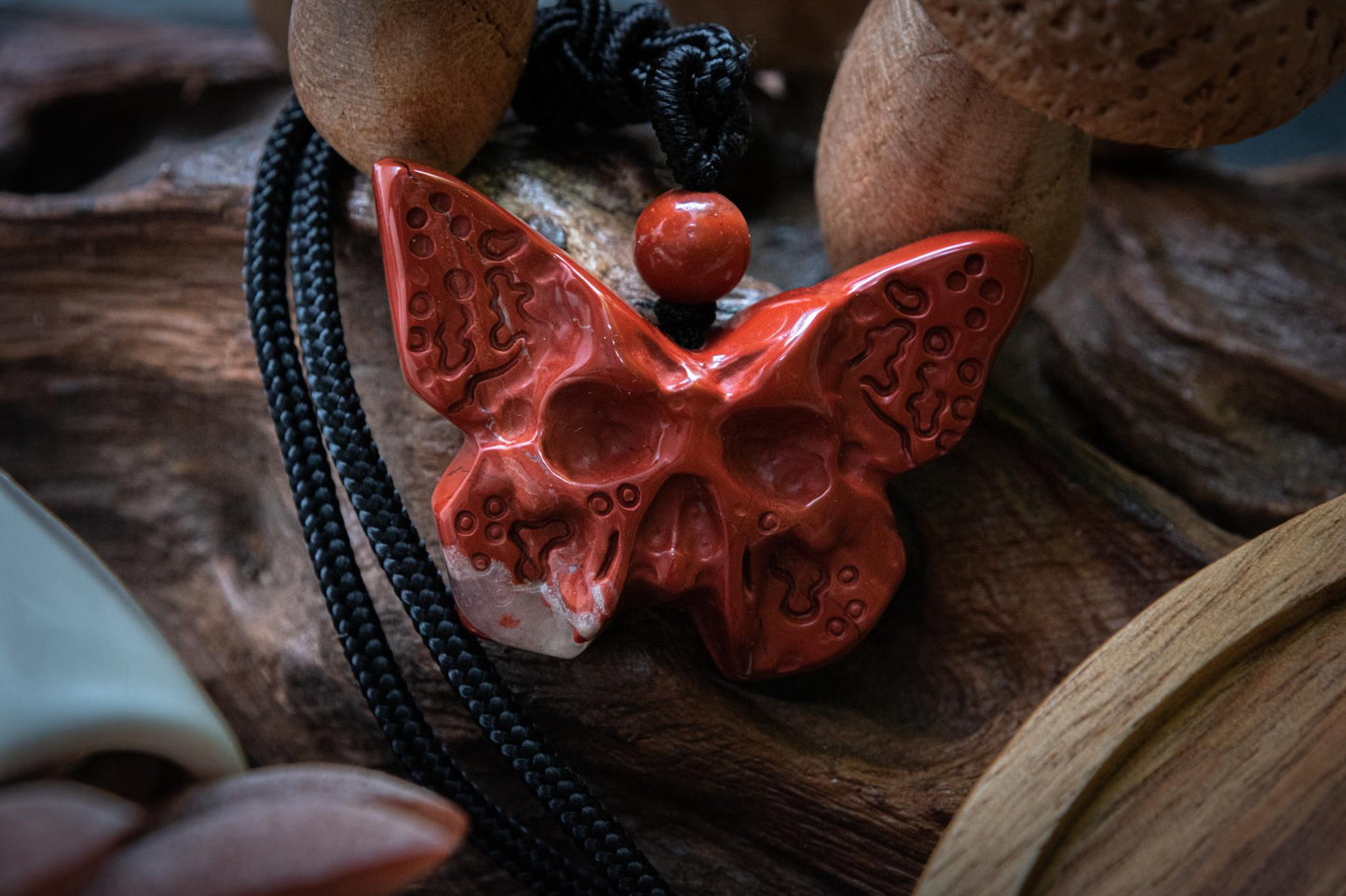 Red jasper butterfly skull carving necklace